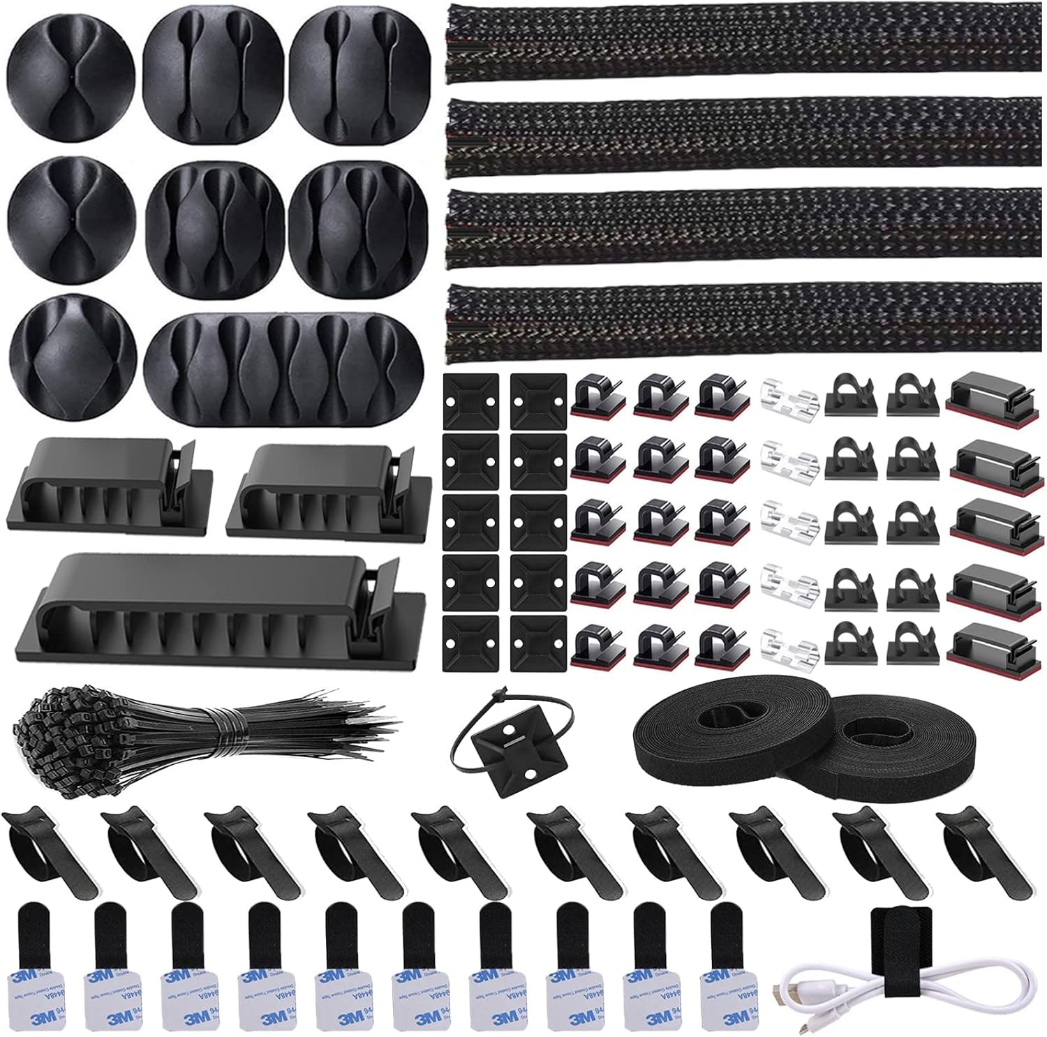 Cable management kit laid out with braided sleeves, adhesive clips, straps and fastening ties