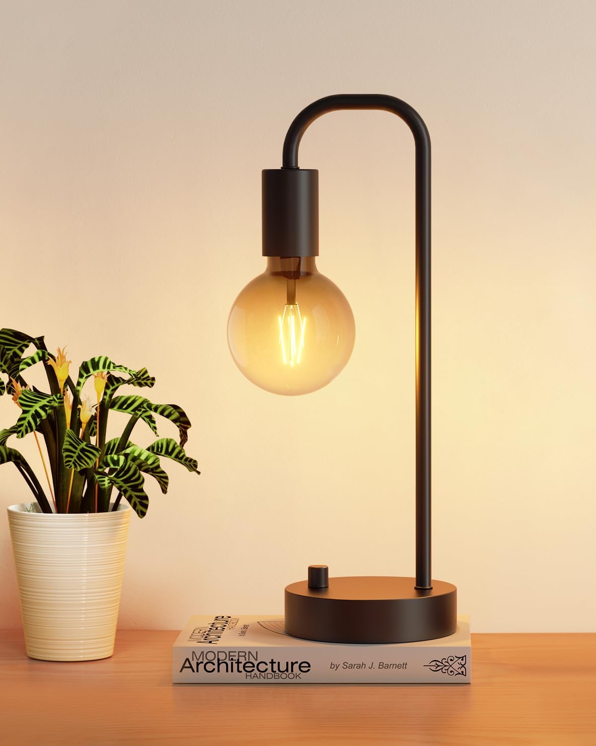 ONEWISH industrial-style dimmable bedside table lamp with metal base and warm glowing bulb