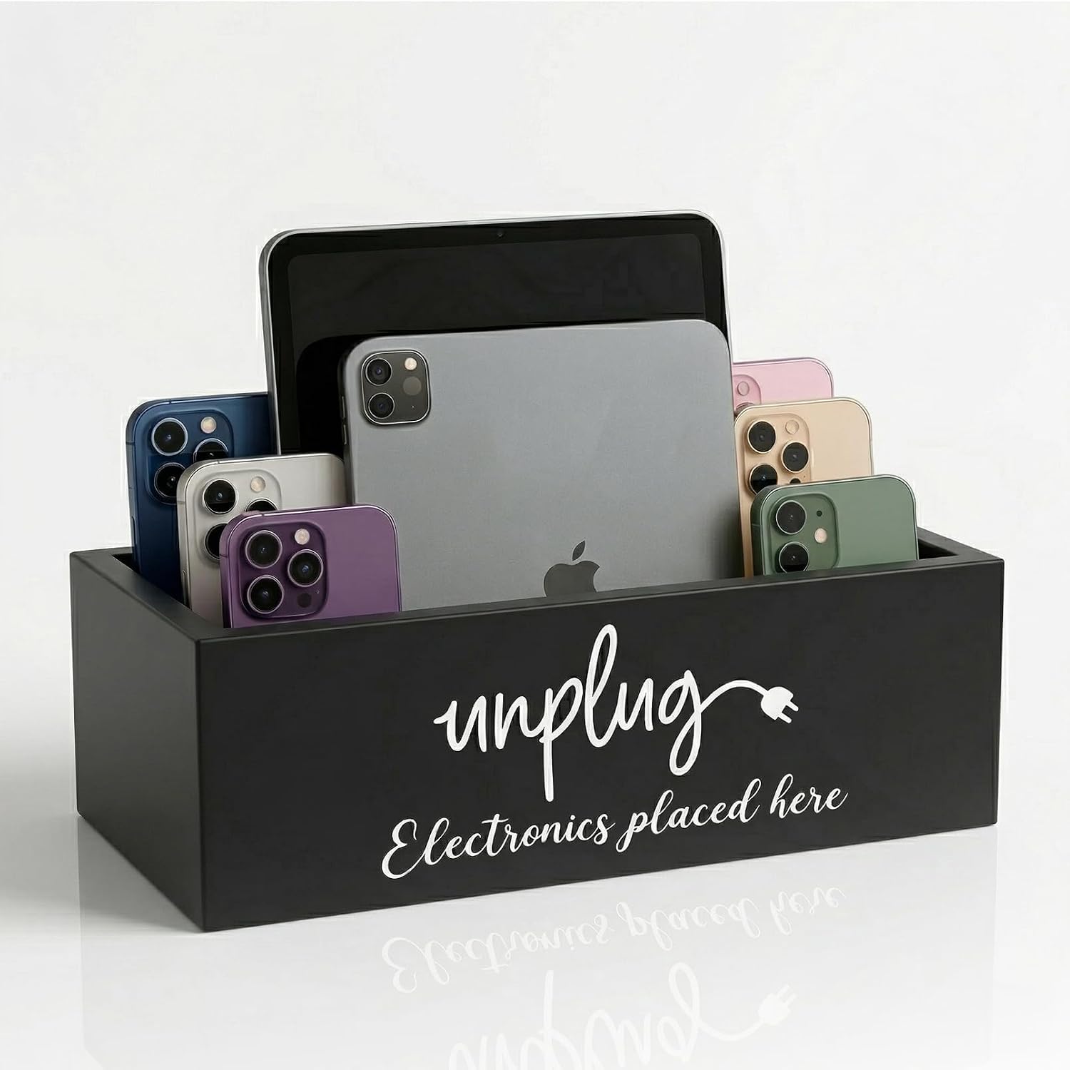 Black farmhouse-style wooden unplug box phone basket holding several mobile phones
